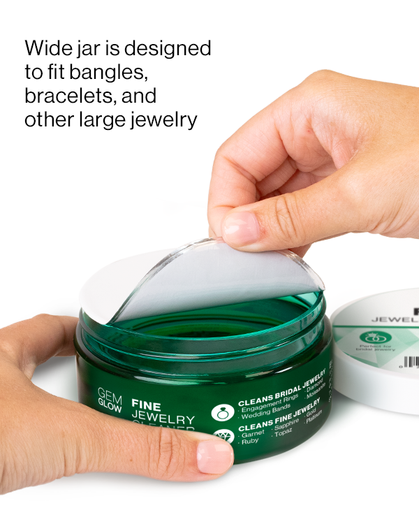 Hands opening a jar of Fine Jewelry Cleaner